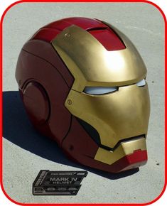 an iron man helmet sitting on the ground