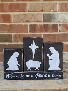 three wooden blocks with the words for unto us a child's born