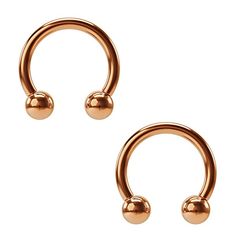 pair of gold nose rings with two balls on each end