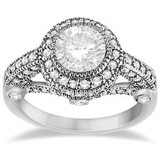 a white diamond engagement ring with two rows of diamonds on the band and an oval center stone