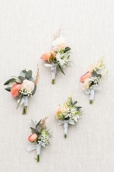 the bridal bouquets are arranged on the table