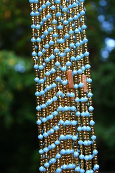 Traditional waist beads hand crafted in Ghana. Made with gold glass seed beads, and baby blue crystal beads. A few with the beautiful Champagne tube accents are available. 💫 Strung on cotton string with no clasp. Fits up to 48 INCHES Comes with one strand Blue Crystal Beads, Color Meanings, Waist Beads, Cotton String, African Beads, Glass Seed Beads, Gold Glass, Blue Crystals, How To Make Beads