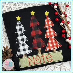 an embroidered christmas tree with the word'nate'in red, white and black