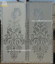 an intricately designed metal door with decorative designs