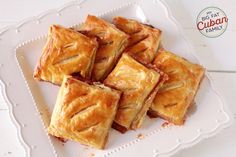 small square pastries on a white plate