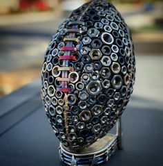 a sculpture made out of metal rings on top of a table