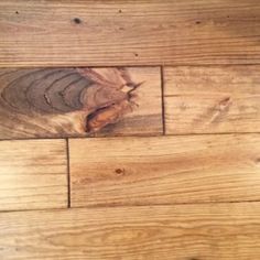 a wooden floor with wood grains on the top and bottom part of it's surface