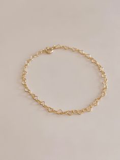 Handmade Heart of Gold Bracelet 🤍✨ 18 Karat Gold Filled Heart Chain Bracelet  Handmade to your exact wrist size, please indicate your wrist size in the notes section at checkout.  Choose from small (2.3mm) or large (3.2mm) size heart chain.  All 18 karat gold filled metal is hypoallergenic, nickel free, and lead free.  Handmade ethically in my home studio in Brookings, South Dakota.  Each piece is packaged in my Mandy Ellen Designs gift packaging with a polishing cloth included. Dainty Chain Charm Bracelet, Dainty Chain Jewelry For Valentine's Day, Dainty Heart Bead Bracelet Jewelry, Dainty Heart Beaded Jewelry Bracelet, Dainty Heart Beads Bracelet, Dainty Valentine's Day Jewelry Chain, Minimalist Heart-shaped Bracelet With Delicate Chain, Dainty Heart Bracelet For Valentine's Day, Dainty Delicate Chain Bracelets For Valentine's Day