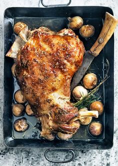 a roasting pan filled with meat and vegetables