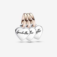 Celebrate generations of love with the Two-tone Splittable Family Generation of Hearts Triple Dangle Charm. This charm is made up of three individual heart charms, crafted from sterling silver with 14 rose gold-plated bails. Each one is engraved with a different family member: "Grandmother", "Mother" and "Daughter". Share them between the three of you and each wear them as a love message between generations, wherever you go. - Pandora Two-tone Splittable Family Generation of Hearts Triple Dangle Heart Charm Dangle Charms For Anniversary, Heart Dangle Charms For Anniversary, Anniversary Heart Dangle Charms, Engraved Charms For Anniversary, Rose Gold Heart Charm, Personalized Sterling Silver Charms In Rose Gold, Rose Gold Heart Charm For Valentine's Day, Valentine's Day Rose Gold Heart Charm, Elegant Rose Gold Heart Charm