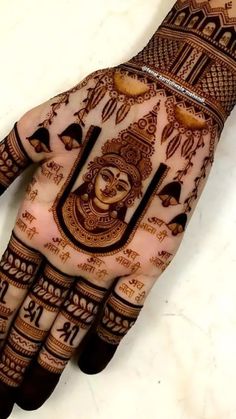 the hand is decorated with intricate designs