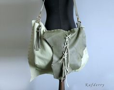 This bohemian bag is made of genuine  leather in light and dark olive green tones. I use fringe details.  There are 2 pockets inside and one of them is zippered. All sewings are handmade  carefully.  Its  width is 44 and height is 32 cm. Thickness is 8 cm. (17'' x12,5'' x 3'' ) Please note that color may vary according to monitor color calibrations. If you have any question, please don't hesitate me to ask whatever you want know. Bohemian Green Bag With Fringe, Bohemian Green Leather Bags, Green Fringe Shoulder Bag For Everyday Use, Green Fringe Travel Bag, Green Travel Bag With Fringe, Green Tassel Bag For Everyday Use, Green Bag With Tassels For Everyday Use, Green Tassel Bags For Everyday Use, Green Bags With Tassels For Everyday Use