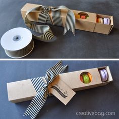 two boxes with different colored macaroni and cheese wrapped in ribbon, one is open and the other is closed