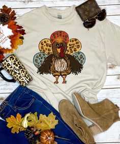 Gobble til you Wobble and add a little fun to your Thanksgiving activities with our Turkey with Leopard Feathers graphic tee shirt! This tee is offered in short or long sleeve options. Makes the perfect Thanksgiving graphic tee! Funny Thanksgiving Shirts Zazzle, Funny Print Long Sleeve T-shirt For Fall, Fun Long Sleeve Fall T-shirt, Multicolor Graphic Print T-shirt For Fall, Cute Pre-shrunk Shirt For Fall, Multicolor Short Sleeve Shirt For Fall, Cute Multicolor Tops For Fall, Fun Fall T-shirt With Funny Print, Fall Cotton T-shirt With Funny Print