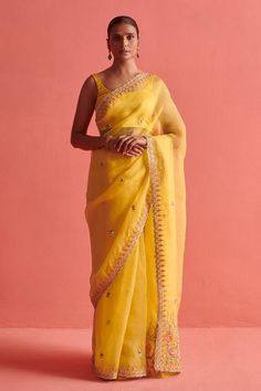 Yellow hand embroidered organza saree with mix of french knots and dabka work in tulip floral jaal pattern on pallu and border. Paired with a sleeveless matching mashru silk padded blouse and petticoat. - Aza Fashions Designer Pre-draped Organza Saree For Eid, Designer Organza Pre-draped Saree With Dori Work, Party Organza Pre-draped Saree With Gota Work, Designer Organza Pre-draped Saree With Sheer Dupatta, Festive Chanderi Sleeveless Saree, Festive Organza Pre-draped Saree With Pallu, Yellow Organza Pre-draped Saree For Eid, Yellow Tissue Silk Pre-draped Saree With Dori Work, Transitional Anarkali Pre-draped Organza Saree