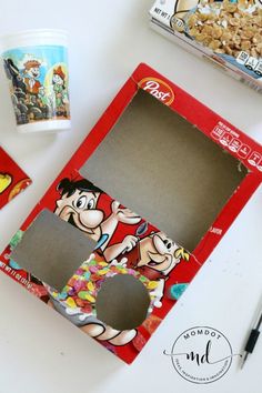 the cereal box has been decorated with cartoon characters and is ready to be put in