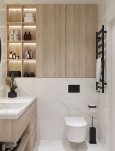 a white toilet sitting in a bathroom next to a sink and wooden cabinet above it