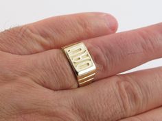 "Fabulous 14k Solid Yellow Gold DAD Ring!! Material: 14k gold , Not plated or filled Weight: 6.40 grams Size: 9 1/4 , Can be sized Top size: 5/8\" long by 3/8\" wide Gift box included Images may be enlarged to show detail and the item may look larger than it appears in person.In order to reduce buyer remorse and return please pay attention to the photos and read description to make sure about measurements such as size , thickness, and length before the purchase. Should you have any concerns or q Gold Rectangular Signet Ring Stamped 14k, Gold Rectangular Signet Ring For Anniversary, Rectangular Yellow Gold Jewelry For Anniversary, Rectangular 14k Gold Collectible Jewelry, Rectangular 14k Gold Jewelry For Anniversary, Rectangular 14k Stamped Yellow Gold Jewelry, Yellow Gold 14k Stamped Rectangular Jewelry, Rectangular Yellow Gold Jewelry For Collectors, Dad Ring