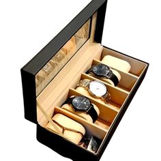 an open watch box with six watches inside