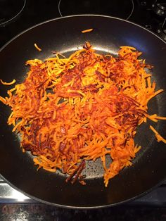 some food is being cooked in a pan on the stove