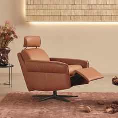 The Aura armchair boasts a small profile and a sophisticated aesthetic, without sacrificing comfort. This power recliner also boasts features that include a manually adjustable backrest, integrated leg rest, and a hidden headrest that can be folded out when desired. Plus, luxe 360° swivel motion, and lumbar support cushions. This piece is also available to custom order in many more materials - custom lead time 18-22 weeks. Explore all custom fabric and leather options here. Console Furniture, Power Recliner Chair, Sophisticated Aesthetic, Leg Rest, Dining Stools, Sofa Storage, Occasional Chair, Dining Room Storage, Single Chair