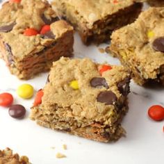 chocolate chip cookie bars cut into squares with candy cornflakes on the top and bottom