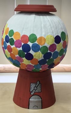 a large paper lantern sitting on top of a wooden table