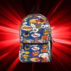 "🎁 HOLIDAY ORDERING DEADLINES🎄 Please note that orders placed after December 12 may not arrive in time for Christmas. Ka-pow! Bam! Boom! Poof! Our cartoon-patterned backpack is straight out of a comic book with its dynamic and action-packed design. The playful bursts of color and iconic comic book phrases make this backpack a favorite among those who love animated nostalgia and quirky expressions. This bag is made from spun polyester and weights 1.3 lbs, just enough to be light, strong and long-lasting. Grab it, stow it, throw it onto the seat next to you, this backpack can take it, and so will you, wherever you go! 100% polyester Lightweight and waterproof Adjustable shoulder straps Assembled in the USA Thank you for choosing to shop with us. We would be delighted to hear from you and h Toddler Boy Backpack, Halloween Party Plates, Blue Fall Decor, Boys Backpack, Women Skeleton, Embroidered Backpack, Baby Backpack, Library Bag, Cartoon Backpack