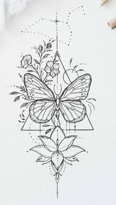 a drawing of a butterfly on top of a piece of paper next to some pens