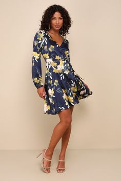 The Lulus Love is Life Navy Blue Floral Print Satin Wrap Dress is always close to our hearts! Woven satiny fabric, in a vibrant green, white, and blush pink floral print, shapes an event-ready wrap dress with long sleeves (plus buttoning cuffs), a surplice neckline, and a fitted waist atop a self-tying wrap skirt. Fit: This garment fits true to size. Length: Mid-thigh to knee length. Size medium measures 37.75" from shoulder to hem. Bust: Great for any cup size. Waist: Loosely Fitted. Hip: Not F Flirty Floral Print Dress For Brunch, Long Sleeve Floral Print Dress For Date Night, Long Sleeve Floral Dress For Date Night, V-neck Floral Dress For Date Night, Feminine Fitted Floral Dress With Surplice Neckline, Flowy Floral Print Dress For Date Night, Floral Print Dress With Surplice Neckline For Brunch, Fitted Floral Dress With Surplice Neckline For Brunch, Spring Floral Print Dress With Surplice Neckline