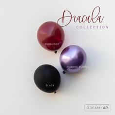 three different colored balloons on a white surface with the words prada collection below them