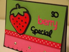 a close up of a card with a strawberry on it