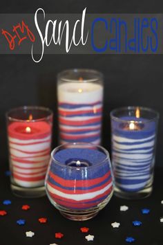 three candles with red, white and blue stripes in them on a black tablecloth