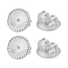 four pieces of silver metal on a white background, including two heart shaped buttons and the other