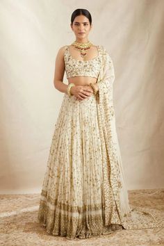 Introducing our collection of Indian ensembles, designed for every memorable moment. Explore our offerings, including attire for the joyful Haldi ceremony, graceful Bridesmaids' Lehenga Choli, intricate Mehendi ensembles, enchanting Engagement Ceremony Lehenga Choli, rhythmic Sangeet Ceremony Lehenga Choli, traditional Tilak/Sagan Ceremony outfits, radiant Haldi Ceremony Lehenga Choli, sophisticated Reception Lehenga Choli, heartfelt Blessing Ceremony ensembles, and opulent Indian wedding attire Astha Narang, White Lehenga Choli, Indian Lengha, Lehenga Choli Designs, Gold Lehenga, Lehenga Choli For Women, Choli For Women, White Lehenga, Party Wear Lehenga Choli