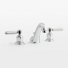 two chrome faucets on a white background