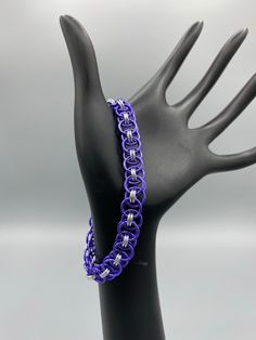 Our chainmaille pieces are woven one ring at a time from aluminum jump rings to make beautiful and fun pieces.   Cleaning:  Can be cleaned with warm soapy water This product is are ready to ship. Metal Chainmail Bracelets As Gift, Handmade Purple Metal Bracelets, Adjustable Chainmail Chain Bracelet As A Gift, Rings To Make, One Ring, Jump Rings, Chain Link Bracelet, Link Bracelets, Arm Band