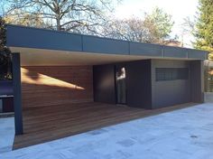 a modern house with wooden slats on the roof