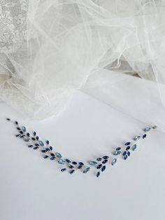 Navy blue bridal hair piece-Blue Bridal Hair Vine-Navy Blue Hair Vine-Blue Hair Piece-Wedding Hair Vine-Blue Wedding Hair Accessories ---------------------------------------------------- Materials: - jewelry wire silver plated, -  navy blue rhinestone -  blue opal rhinestone - langth of hair vine 50 cm ( 19.68in.) --------------------------------------------- The vine is made in the color navy blue,blue opal and the wire is silver plated This vine will be the perfect addition to your wedding loo Blue Bridal Hair Piece, Navy And White Bridal Hair Piece, Blue Hair Pins, Navy Blue Hair, Blue Wedding Hair, Blue Hair Accessories, Blue Bride, Hair Accessories Boho, Bridal Hair Vine