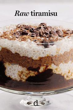 a cake with chocolate and white frosting in a glass dish