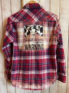 This is a custom made and one of a kind bleached flannel shirt. Created with an upcycled Jach's Girlfriend flannel. Long sleeve button up with Should've come with a warning print on the back. Perfect for any Morgan Wallen fan! Makes a great gift! Size Small. Measures 19" underarm to underarm and 26 1/2" in length. Snap up closure  All flannels are freshly laundered, pressed and pre shrunk. Created in a smoke and pet free environment. Fall Cotton Flannel Shirt For Rodeo, Casual Plaid Flannel Shirt For Rodeo, Country Style Cotton Shirt For Fall, Casual Cotton Flannel Shirt For Rodeo, Bleached Flannel Shirt, Flannel Shirt, Bleach, Custom Tshirts, Custom Made