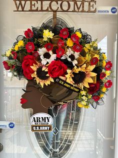 the front door is decorated with flowers and an army hat on it's head