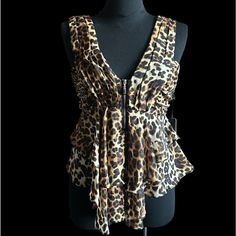 Leopard Print Sleeveless Top Plunging Neckline Ruched Waist Exposed Silver Front Zipper Tiered Ruffle Hem Fabric 100% Polyester Measures Small Ap 15 W 28 L 23 Med Ap 16 W 29 L 24 Large Ap 17 W 30 L 25 *Bundle For Discount *Ships Same Or Next Business Day Leopard Print Top Tops Blouses Streetwear Leopard Print Sleeveless Tank Top For Party, Elegant Sleeveless Leopard Print Tops, Chic Leopard Print Sleeveless Top, Sleeveless Leopard Print Top For Night Out, Wrap Tunic, Lace Short Sleeve Top, Flare Long Sleeve, Satin Short, Sheer Shorts