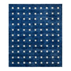 a blue rug with white squares on it