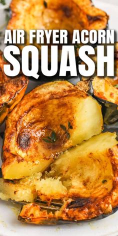 air fryer acorn squash on a white plate with text overlay that reads, air fryer acorn squash