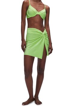 A twist-front detail defines this shimmering cover-up sarong that's ready for some fun in the sun. 75% nylon, 14% elastane, 10% Lurex® metallic fibers Machine wash, tumble dry Imported Black Owned/Founded Green Ruched Swimwear For Party, Chic Solid Color Swim Skirt For Summer, Chic Draped Summer Bottoms, Chic Summer Party Sarong, Spring Pool Sarong, Green Summer Swimwear For Night Out, Green Swimwear For Summer Night Out, Summer Party Bottoms With Ruched Detail, Chic Sarong For Beach Season Party