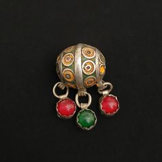 Handmade in Tiznit. Very old and Rare small bead (tagmoutt). Raw silver and enamel. Pendants containing ancient glass agate. Great bead for making a necklace Or with thread. In good condition and fast shipping. *weight: 20.3 gram *length and width: 2.8 cm/ 4.5 cm If there is any other question send me a message and i will be very happy to answer it as son as possible. Visit my store: https://www.etsy.com/fr/shop/Berberjewelery Silver Meenakari Round Bead Jewelry, Traditional Silver Pendant Beads, Making A Necklace, Mersad Berber Paintings, Enamel Pendants, Berber Jewelry Morocco, Berber Jewelry, Vintage Amber Beads, Gems, And Cabochons, Handmade Vintage Multicolor Beads, Gems, And Cabochons