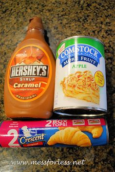 some food items are sitting on a counter top next to a can of marmalade