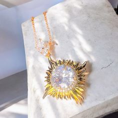 A statement necklace with a big dazzling crystal in the center makes a unique gift this christmas season Aesthetic Christmas Gift Ideas, Necklace Aesthetic, Sun Necklace