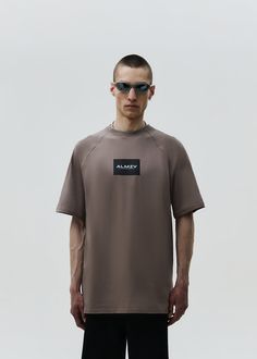 Oversized unisex t-shirt. The soft and breathable cotton material ensures all-day comfort, while the oversized fit that is flattering on all body types. Featuring minimalistic label print Material: 95% cotton, 5% elastane Model wears: L sizeModels height: 187 cm Oversized Brown T-shirt For Everyday, Oversized Brown T-shirt, Oversized Brown T-shirt With Text Print, Oversized Modern Tops With Logo Print, Modern Oversized Tops With Logo Print, Oversized Brown Top With Text Print, Brown Crew Neck Athleisure Top, Brown Athleisure Crew Neck Top, Brown Crew Neck Top In Athleisure Style